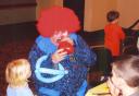 George Wray as BOO the clown making balloon animals